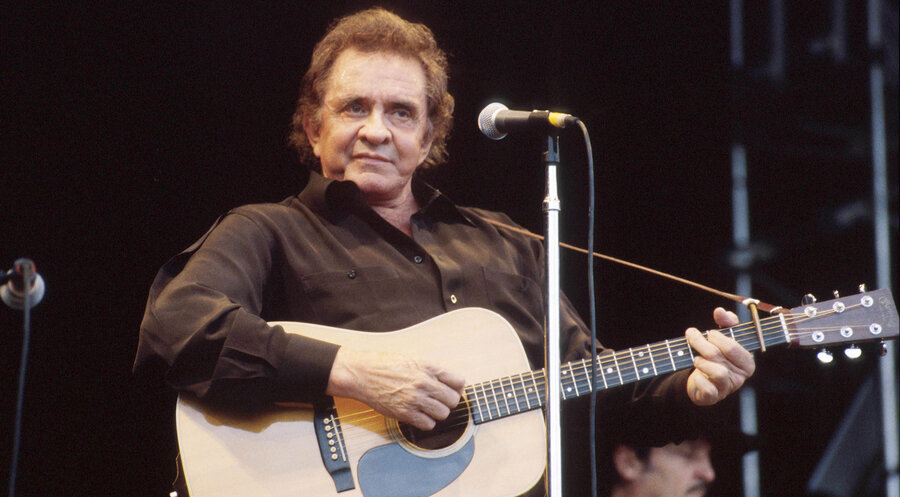 Johnny Cash bei einem Konzert. Foto: Picture Alliance/Avalon/Retna | Michael Putland