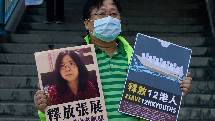 Ein Menschenrechtler demonstriert für die Freilassung von Zhang Zhan und 12 weiteren Aktivisten. Foto: picture alliance / ASSOCIATED PRESS | Kin Cheung